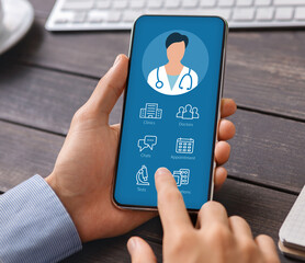 Man holding phone with online medical app on screen