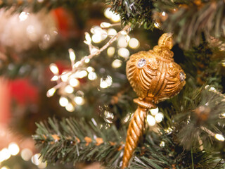 Christmas tree with shiny vintage decorations. Fir tree decorated with light bulbs, retro balls for New Year celebration.