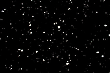 Falling snowflakes on black background, snowing at night, snow flakes fall 