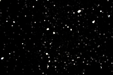 Falling snowflakes on black background, snowing at night, snow flakes fall 