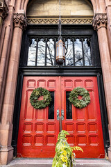 Fototapeta na wymiar The beautiful Christmas decorations on the doors outside of St. Georges Church in New York City. (Photo: Gordon Donovan)