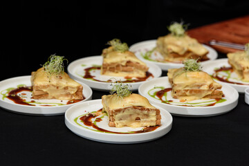 Francesinha, traditional Portuguese sandwich originally from Porto. National cuisine concept. the chef prepares a dish at restaurant