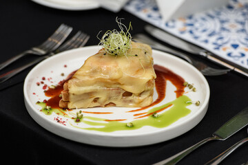 Francesinha, traditional Portuguese sandwich originally from Porto. Served in a restaurant