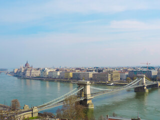 View of Budapest Chain Bridge and St. Stephen's Basilica in the distance from a viewpoint at Buda Castle - Budapest, Hungary