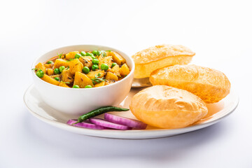 Poori Masala or potato curry with fried puri - obrazy, fototapety, plakaty