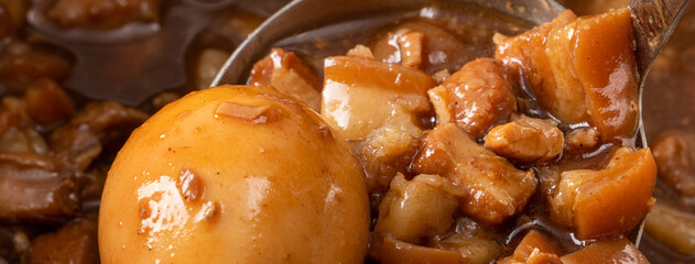 Cooking braised pork for eating with rice. Taiwanese traditional food.