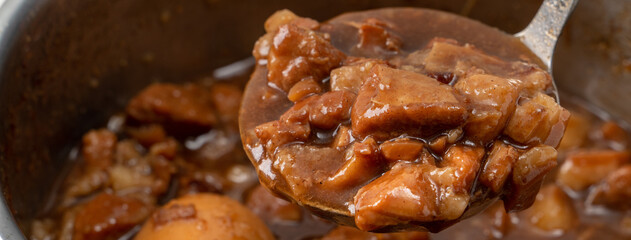 Cooking braised pork for eating with rice. Taiwanese traditional food.