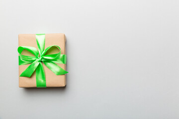 Holiday present box over colored background, top view. Copy space for design