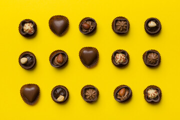 Different kinds of chocolates on colored table close-up. Top View and Flat Lay