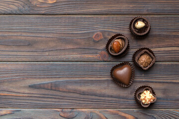Fototapeta na wymiar Different kinds of chocolates on colored table close-up. Top View and Flat Lay with copy space