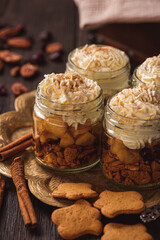 Apple dessert in glasses with cinnamon, walnut, gingerbread and mascarpone. 