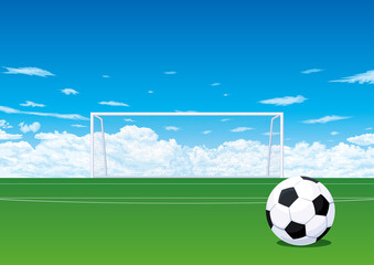 ピッチのサッカーボールとゴールと青空 © kimkimchin