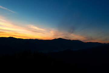 Silhouette of mountain landscape at sunset. Drone photography