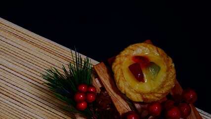 Christmas Concept, Food Photography, Close up, fruit cake with kitchen utensils neatly arranged and simple which gives an elegant impression, Food and beverages concept.