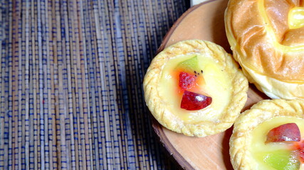 Christmas Concept, Food Photography, Close up, fruit cake with kitchen utensils neatly arranged and simple which gives an elegant impression, Food and beverages concept.