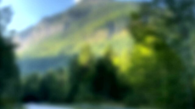 Engalm Valley at Karwendel mountains in Austriaю Shooting through not quite clean car glassю Blurred view