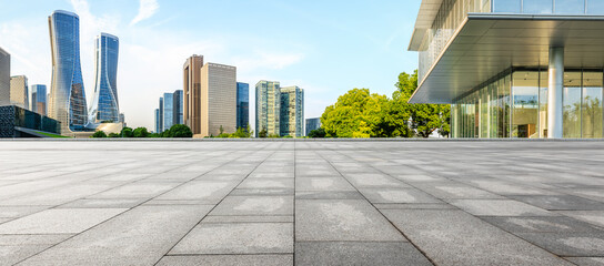 Panoramic skyline and modern commercial office buildings with empty square floors