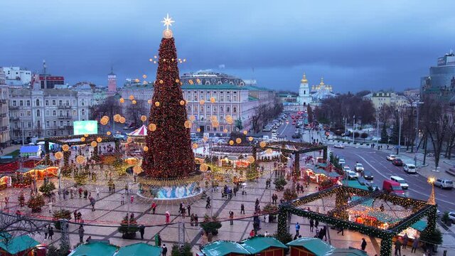 Kiev, Ukraine - December 20, 2021: People enjoy the view of the New Year tree 2022 on Sophia Square, Kyiv, Ukraine