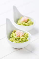 Fresh guacamole with caviar lime (Australian finger lime) fruits