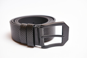 Big black leather belt with a metal buckle on a white background.