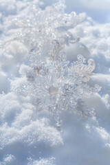 Snowflake decoration on natural snowy ground