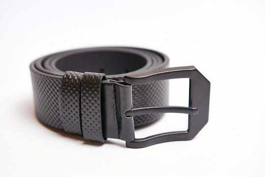 Big Black Leather Belt With A Metal Buckle On A White Background.