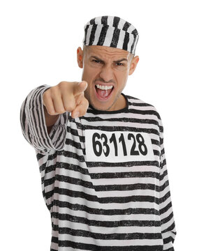 Emotional prisoner in striped uniform pointing at camera on white background