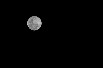 Close up full moon on the Black sky