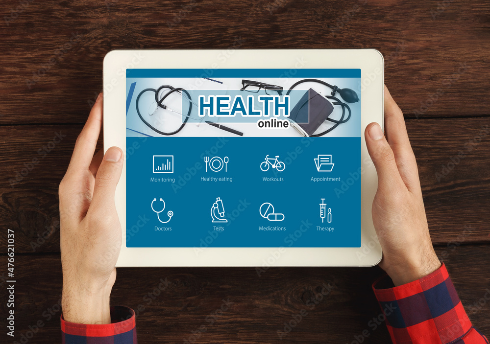 Aufkleber cropped of man using online health application on tablet