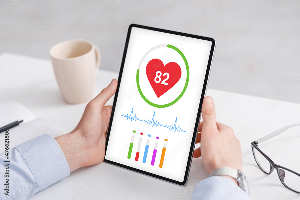 Poster cropped of man using healthcare application on digital tablet