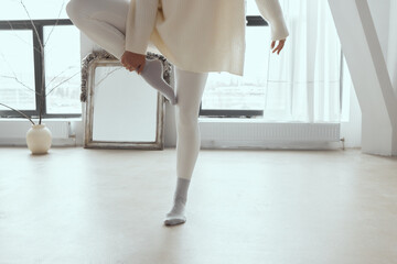 woman doing yoga asana in a spacious studio.