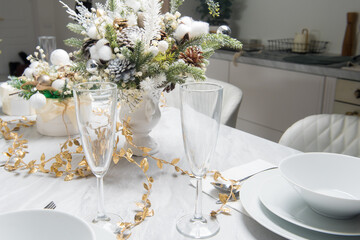 Christmas table with eating utensils. New Year's Eve dinner.