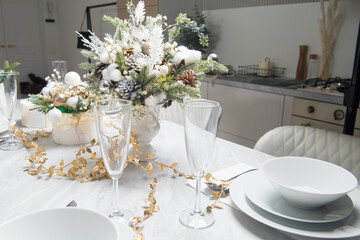 Christmas table with eating utensils. New Year's Eve dinner.