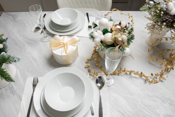 Christmas table with eating utensils. New Year's Eve dinner.