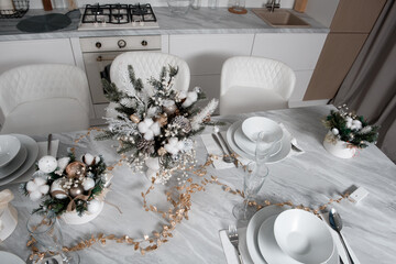 Christmas table with eating utensils. New Year's Eve dinner.