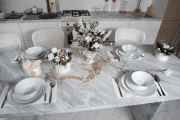 Christmas table with eating utensils. New Year's Eve dinner.