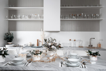 Christmas table with eating utensils. New Year's Eve dinner.