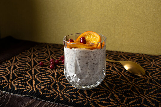 Sweet stracciatella ice cream with slices of orange and berries