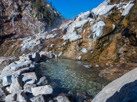Hot Spring in Idaho with steam billowing during the morning