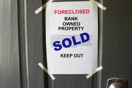 Foreclosed property notice taped on  a house door property