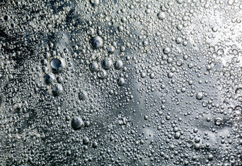 Abstract background with bright circles. Colorful image, drops of oil on the water.
 Liquid abstraction. 