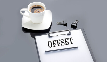 OFFSET text on paper sheet with coffee on the black background