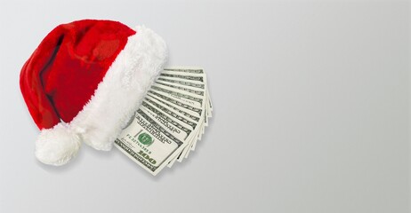 Christmas hat with currency. New year or Christmas gift concept. Money inside Santa hat.
