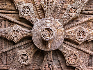 Close up image of 13th Century AD , Ornately carved stone wheel on the ancient Surya Hindu Temple...