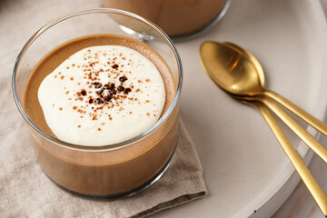 Italian chocolate and coffee mousse dessert semifreddo - half-frozen ice cream with whipped cream and cocoa powder in small glasses
