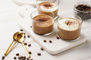 Italian chocolate and coffee mousse dessert semifreddo - half-frozen ice cream with whipped cream and cocoa powder in small glasses