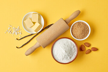 baking ingredients on yellow background