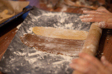 person kneading dough