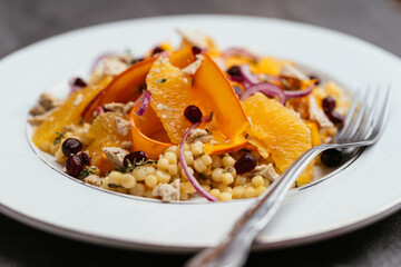 Salad with marinated winter squash,  oranges and vegan feta on perl couscous.