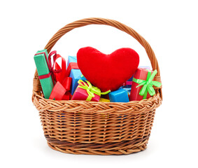 Fototapeta na wymiar Gifts in the basket with heart.